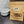 Load image into Gallery viewer, Kraft paper bag with pet treats labeled 'Purple Ribbon' on a dark surface with a wicker basket and white bowl in the background.