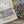 Load image into Gallery viewer, Dog treats in a bowl and packaging with 'Purple Ribbon' branding on a wooden surface.