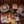 Load image into Gallery viewer, Assorted deli meats and cheeses on a wooden table with a plaid cloth.