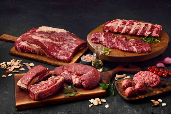 Purple Ribbon Beef Smokin' Beef Bundle featuring 14-day dry-aged Iowa brisket, beef ribs, sirloin tip roast, skirt steak, and ground beef.