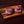 Load image into Gallery viewer, Two raw beef cheeks on a wooden cutting board.

