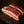 Load image into Gallery viewer, Two pieces of raw beef short ribs on a dark surface
